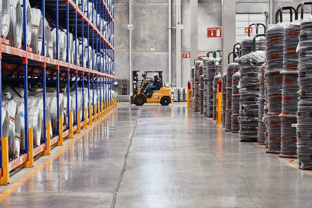 Forklift operator managing inventory in a logistics warehouse